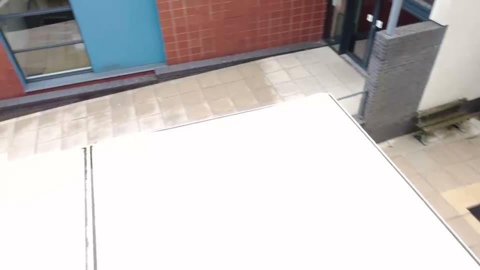 Large commercial paved area before cleaning